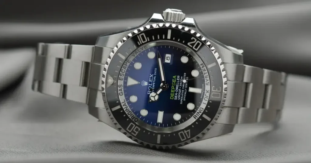 A Rolex with a blue face and a rotating bezel, designed for diving, displayed on a soft surface. Rolex financing is the way to go