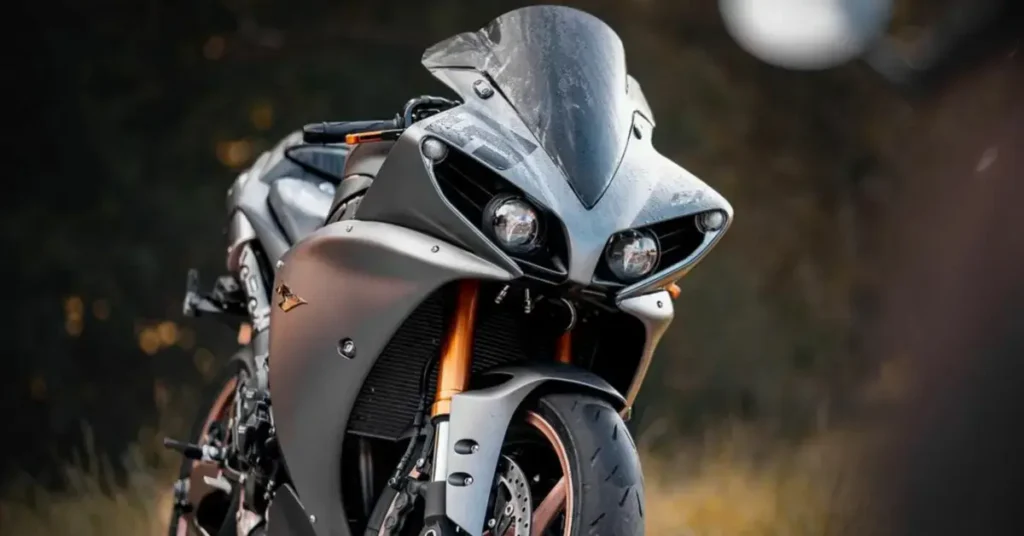 A close-up of the front of a yamaha motorcycle focusing on the headlights and fairing.